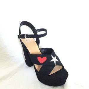 Black chunky platform heels with embroidery